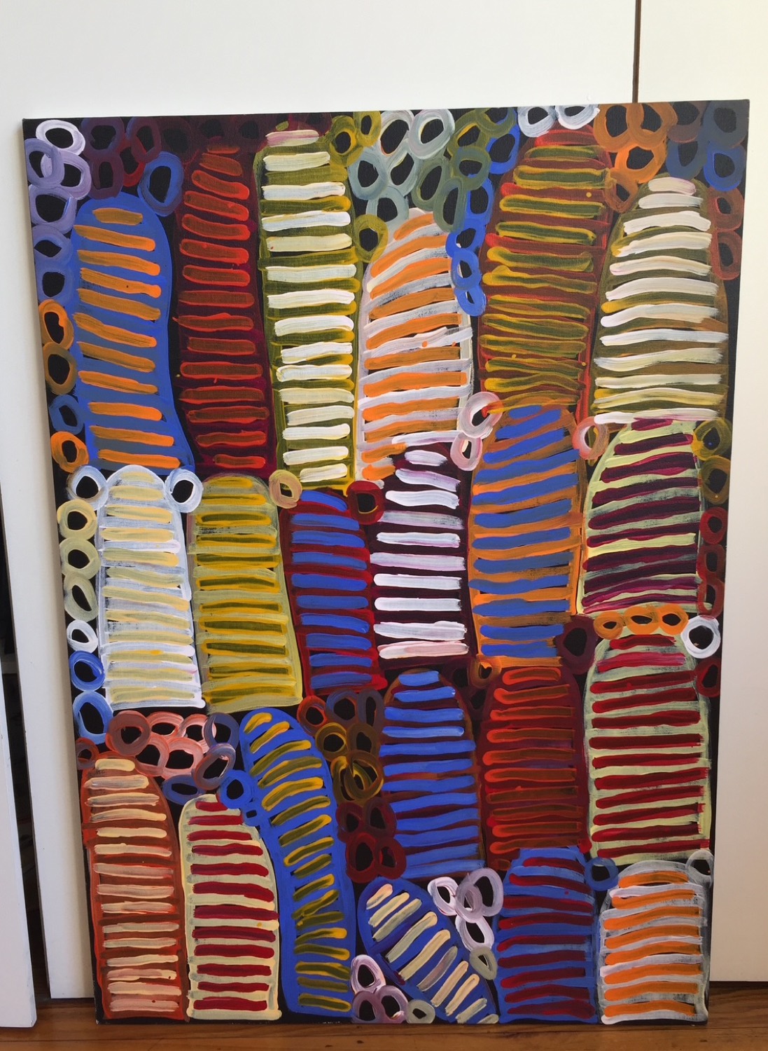 Large contemporary Aboriginal dot painting in vibrant ochres and blues
