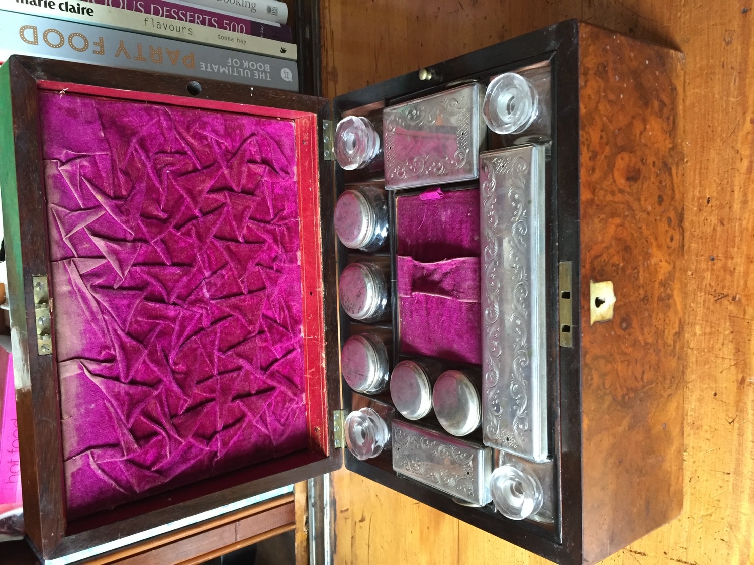 Antique burr-walnut fitted vanity box with cut-glass jars and engraved silver lids