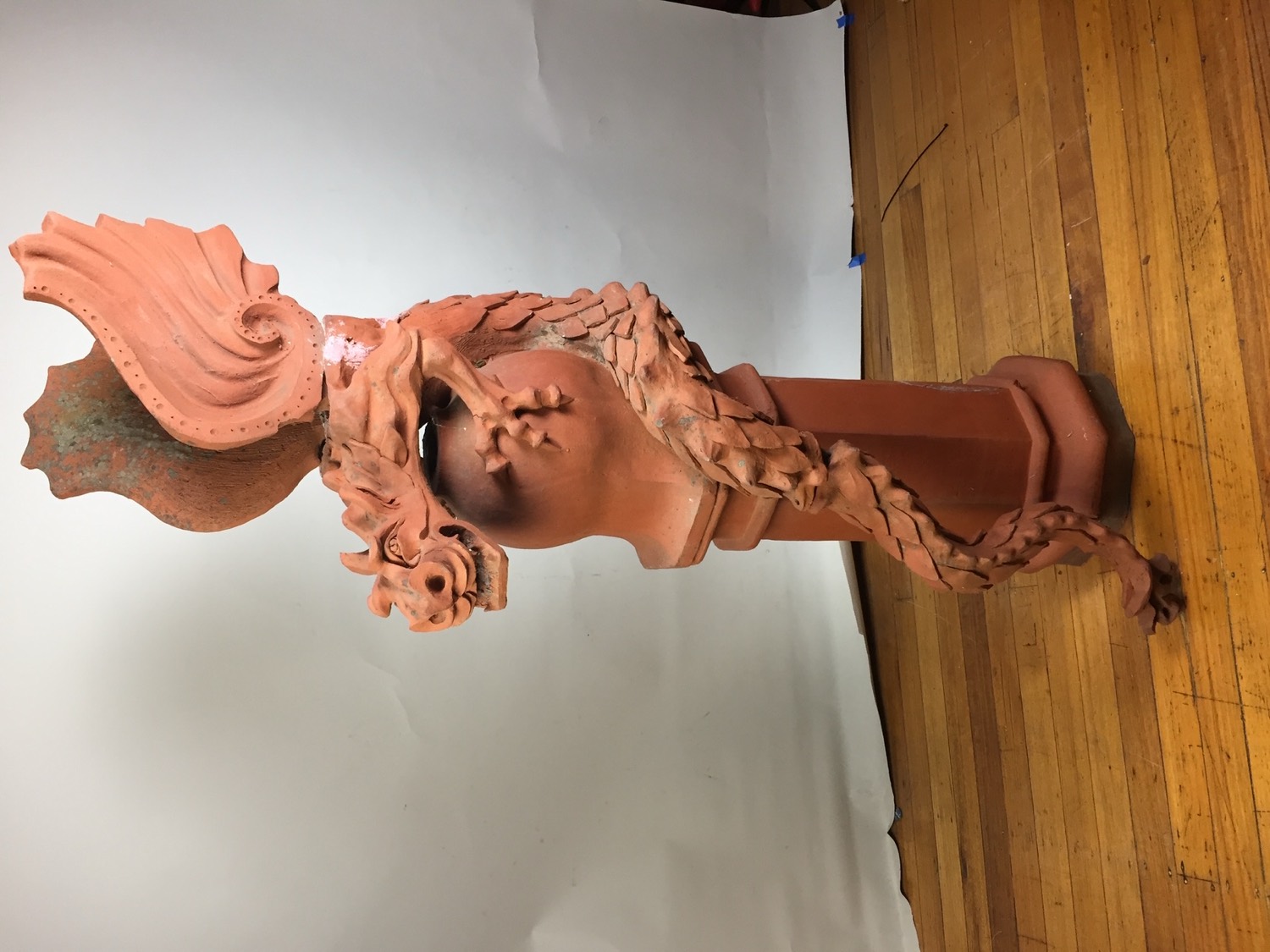 Architectural terracotta chimney finial modelled as a winged griffin