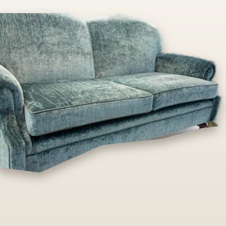 The finished two-seater dressed in sage-green velvet